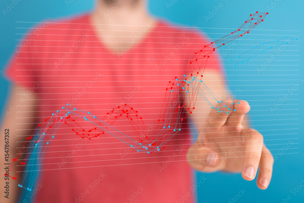 Poster Stock photo of a person interacting with a digital graph showing data trends and analysis.