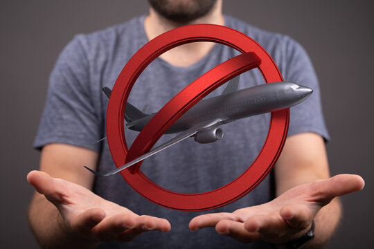 Stock photo of a no fly zone symbol with an airplane. Perfect for travel restrictions, flight cancellations, and airport closures. - Powered by Adobe