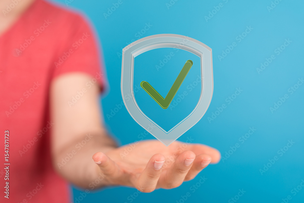 Poster hand holding a digital shield with a checkmark, symbolizing data security, safety, and privacy.