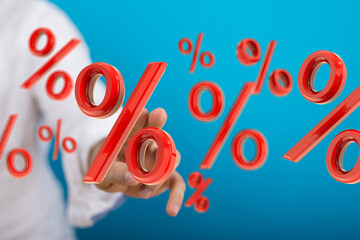 3D render of red percentage symbols floating in the air, hand interacting.