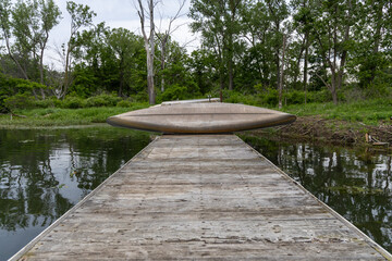 wooden dock with boats on it 