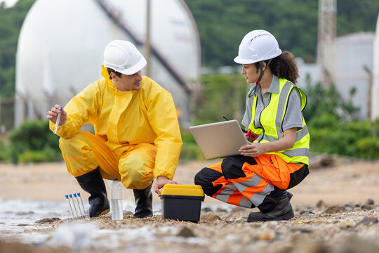 Environmental Scientists Collecting Water Samples for Analysis, Team of Engineers Conducting Environmental Impact Assessment, Industrial Pollution Monitoring and Water Quality Testing