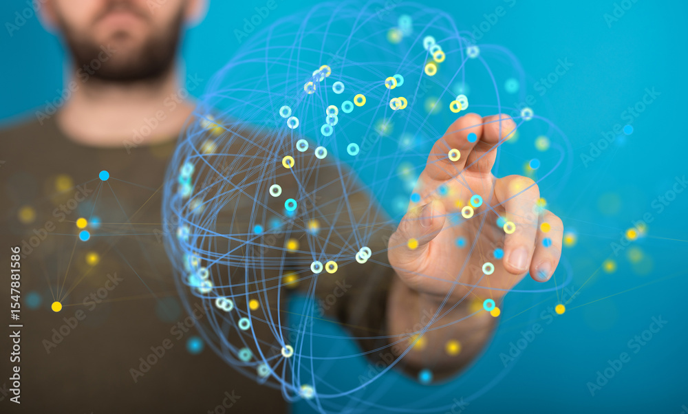 Poster stock photo of a person interacting with a digital globe representing a network.