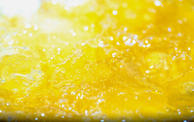 Close up bright orange Oil or beer splash texture and nature waves, Beautiful waves curve and...