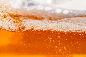 Close up bright orange Oil or beer splash texture and nature waves, Beautiful waves curve and...