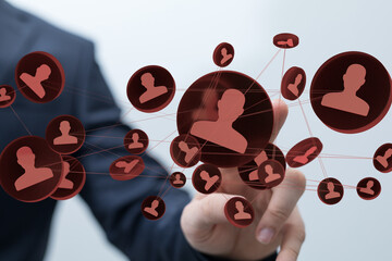 A businessman interacts with a network of digital profiles, illustrating connections and networking.
