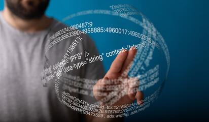 Person touches a holographic sphere displaying lines of code, representing internet data and...