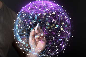 Hand interacts with a digital sphere, showcasing global network connections and data visualization.