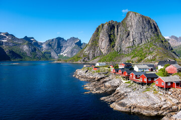 Majestic fjords and traditional red cabins by the water in Norways stunning landscape
