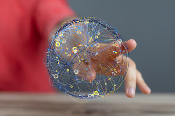 Hand holding a digital globe, representing global network, connection, and technology.