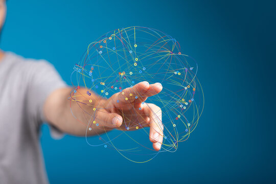 Person's hand reaching towards a digital sphere representing global network connections and data.