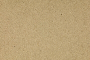 A clean brown cardboard texture, ideal for backgrounds. This recycled paper offers a natural,...
