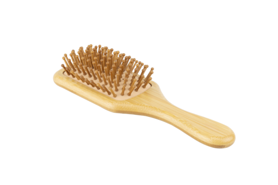 An eco-friendly wooden hair brush with wooden bristles, isolated on a white background. Ideal for hair care, scalp massage, and natural beauty.