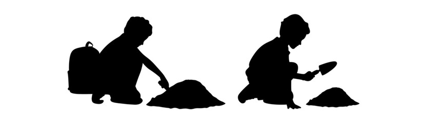 A silhouette image of two children engaged in a playful activity involving sand.