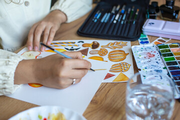 Humorists are Artists Month. Artist Painting Colorful Autumn Motifs on Paper