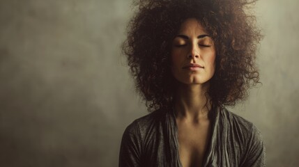 Calm reflection of young african female with closed eyes and curly hair