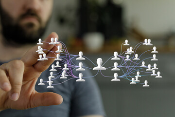 A man interacts with a digital network visualization, showcasing global connections and social...