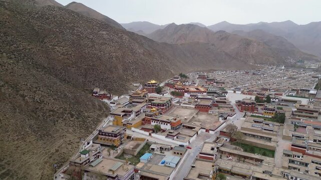 Xiahe, China: Aerial drone footage of ancient temples in the Tibetan Buddhism Labrang Monastery in the Xiahe town on the Tibetan plateau.