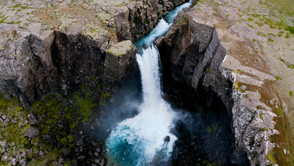Folaldafoss waterfall in Berufjardara river has a drop of approximately 20 meters that look...