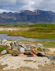 Relaxing in Landbrotalaug Hot Spring amidst Icelands stunning nature