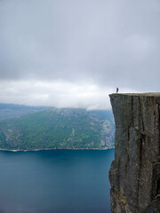 Explore breathtaking cliffs in Norway with stunning views over the water and mountains