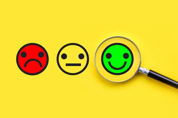 Smiling face in magnifying glass; Finding customer satisfaction