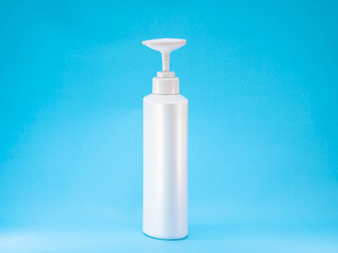 White Plastic Pump Bottle on Blue Background