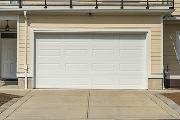 Garage door in luxury house with trees and nice landscape in Spring in Vancouver, Canada, North...