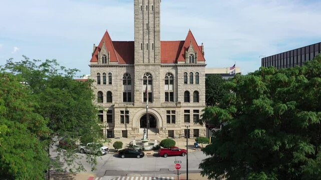 Aerial view captures the iconic courthouse of Parkersburg, West Virginia, surrounded by lush greenery and the vibrant downtown area, reflective of the Appalachian charm.