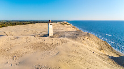 Explore the stunning coastal landscape of Denmark near the iconic lighthouse at Skagen