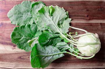 White kohlrabi on a wood cutting board