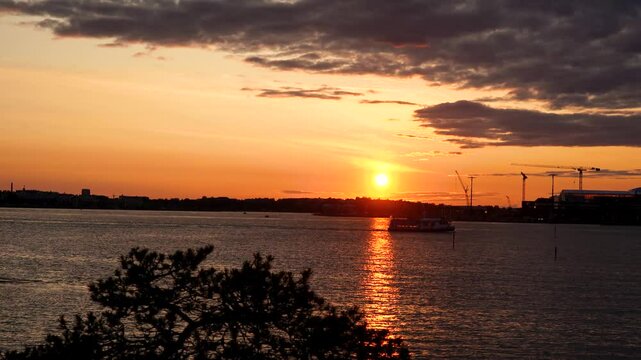 Timelapse video of sunset over the Baltic Sea at Pihlajasaari Island in Helsinki, Finland. The scene captures evening light and calm sea conditions in the Helsinki archipelago.