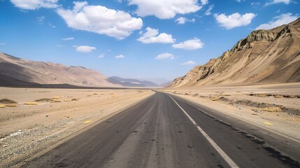  A highway in the desert of Tibet, with a blue sky and white clouds, mountains on both sides, captured in high-definition photography. 