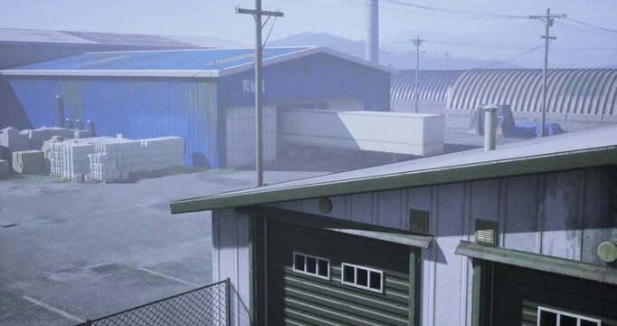 Factory storage units are visible with gray overcast and power lines. The environment reflects a typical industrial setting with probable loading activities.