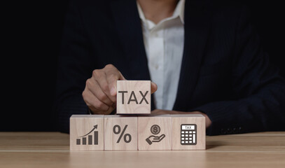 Tax and Financial Planning. taxation and financial management, Wooden blocks showcase tax,...