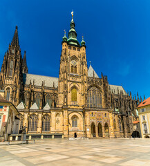 Fototapeta premium A view showing the side entrance to Saint Vitus Cathedral in the castle complex in Prague in springtime