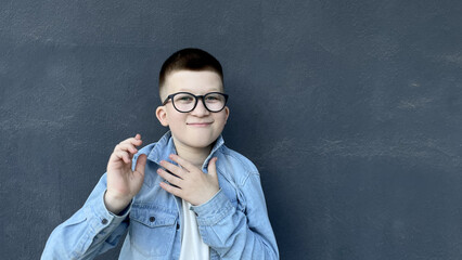 Calm Boy in Denim Shirt and Glasses Posing Thoughtfully