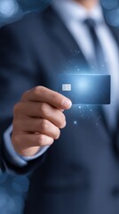A businessman holding a glowing digital credit card represents modern financial technology and secure payment