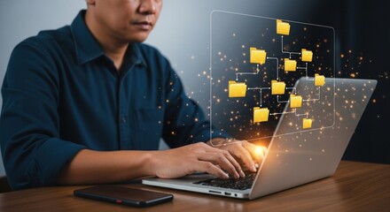 Man using laptop with folder structure overlay for data management and organization display on screen