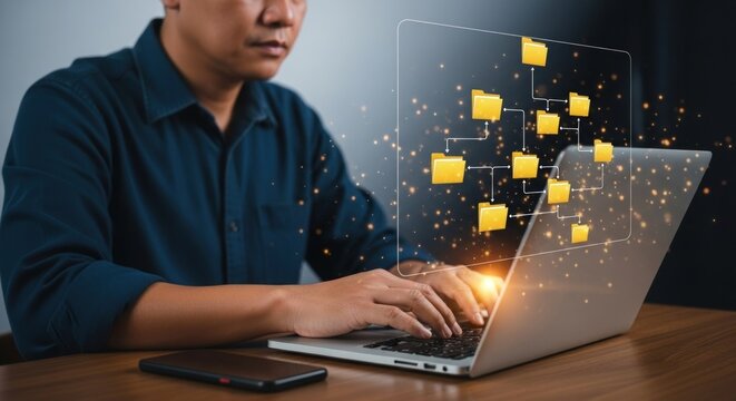 Man using laptop with folder structure overlay for data management and organization display on screen