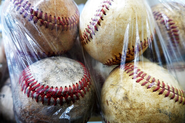 Old Used and Worn Baseballs in a Plastic Sack or Bag for Sale