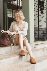 stylish girl, blonde holding cup of coffee, warming drink, good start of day, coffee aroma