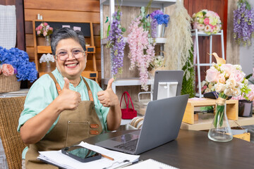 Senior woman, florist small business owner, entrepreneur feeling proud and happy with business...