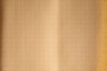paper with grid lines and fold crease in the middle