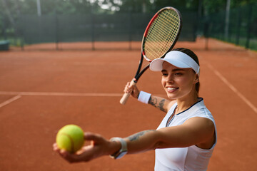 Focused tennis player preparing to serve