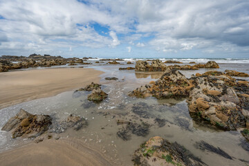 Duckpool  beach natural forming rockpools at low tide