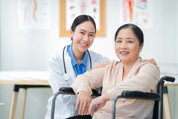 Asian female doctor giving a cheerful high five to an elderly woman patient, both smiling warmly in a medical clinic setting. A joyful moment of healthcare connection, trust, and support between careg