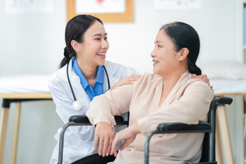 experienced female medical professional explains test results to a female patient during a clinic consultation. reviewing reports and discussing diagnosis and treatment options.compassionate care