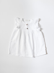 Baby cotton dress for girl flat lay. Clothing production, sewing workshop