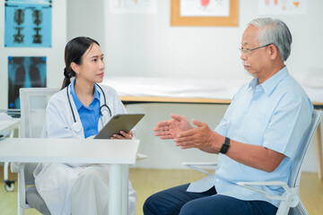 female doctor measures the blood pressure elderly male patient.health consultation, explains medication and prescription details, and offers emotional support. doctor-patient bonding.young profession